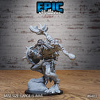 Figurine JDR Troll Shaman Victory, troll chaman levant son bâton, bouche ouverte, avec un bouclier rond à pointes et un pied sur un rocher